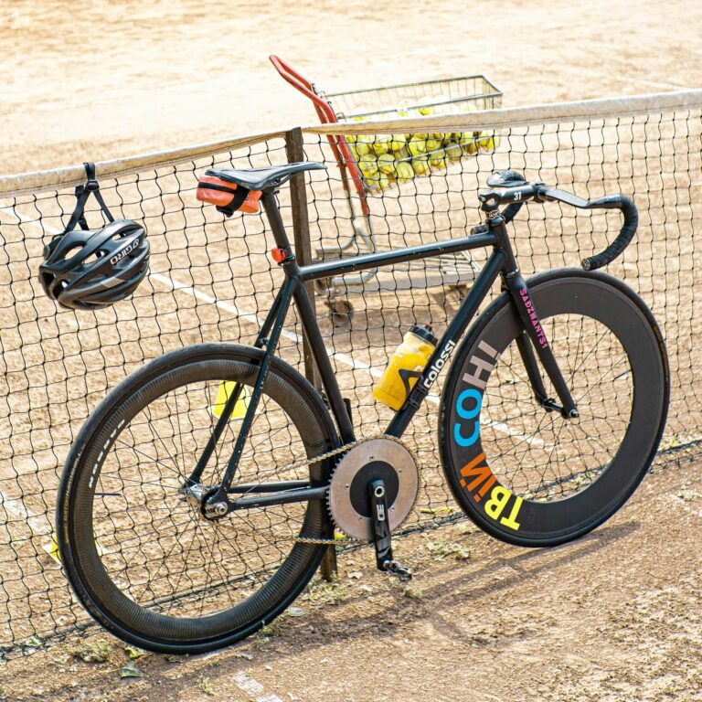 a-bicycle-parked-next-to-a-tennis-net