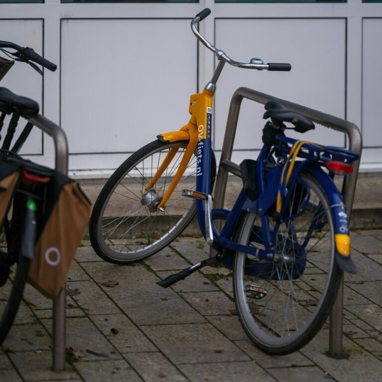a-couple-of-bikes-parked-next-to-each-other